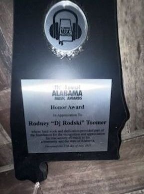 A black shield-shaped Alabama Music Awards honor plaque presented to Rodney “DJ Rodski” Toomer